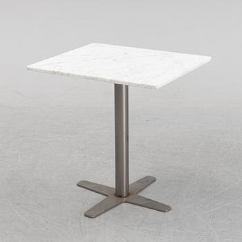 A marble top table, 21th century.