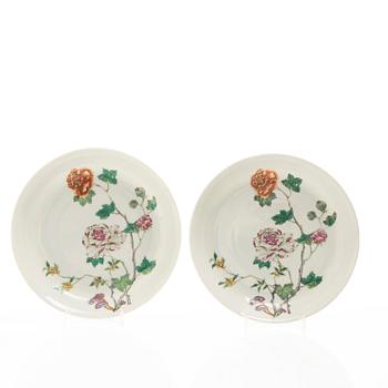 A set of four famille rose floral dishes, Qing dynasty with a apocryphal six character mark.