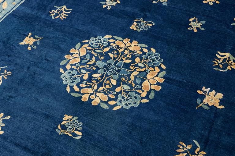 An antique Peking (Beijing) carpet, North China, c. 340 x 275 cm.