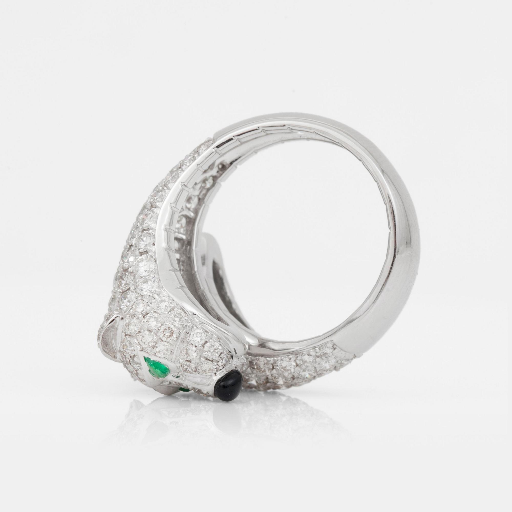 A brilliant-cut diamond, 3.36 cts, agate and emeralds, 0.15 ct, ring.