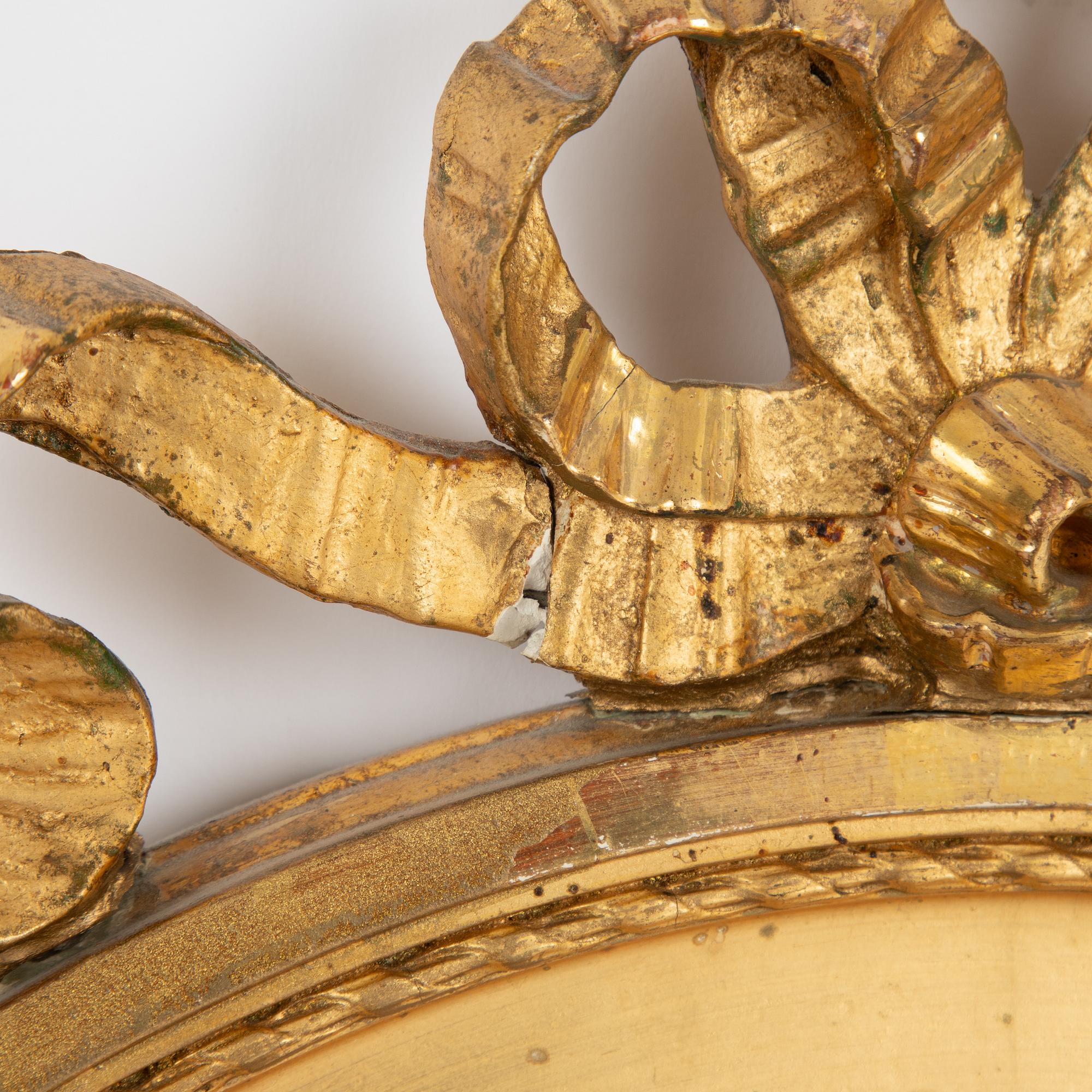 A Gustavian style mirror, first half of the 20th century.