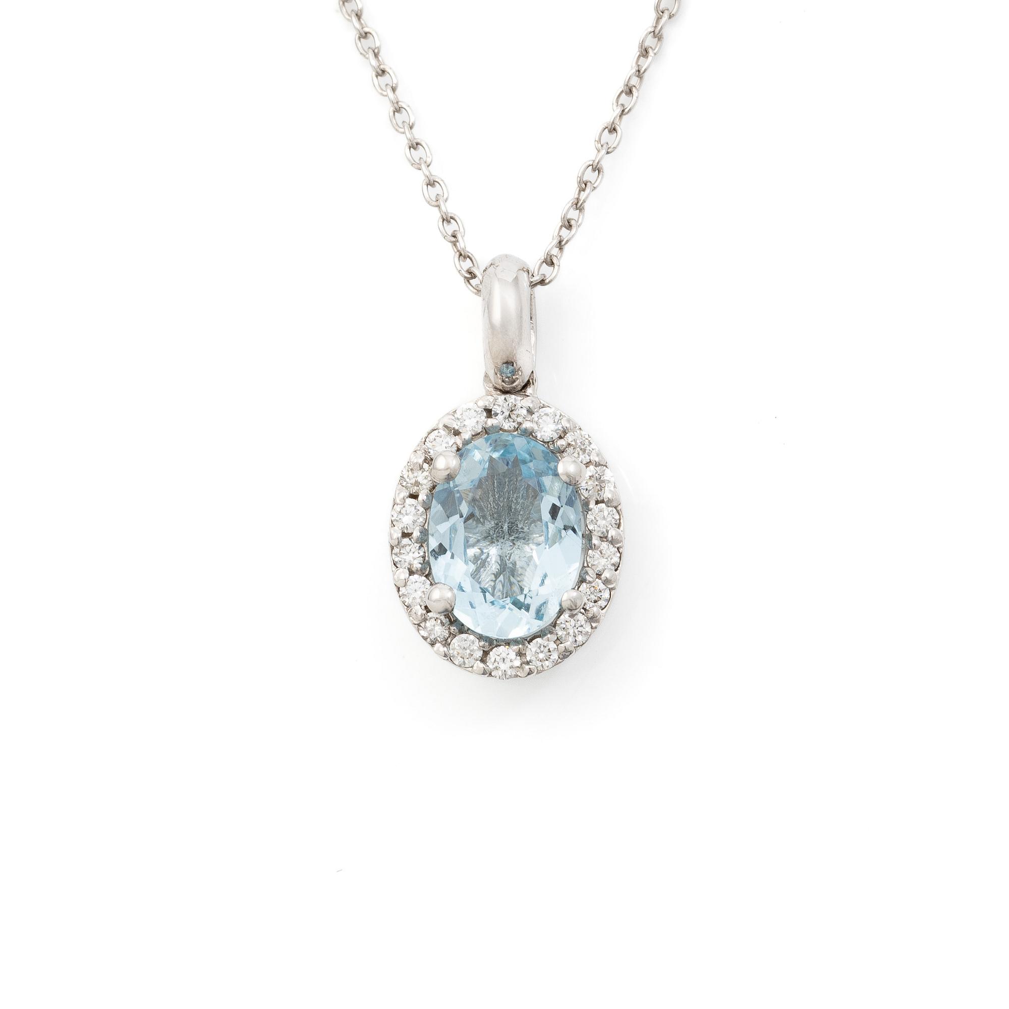 Pendant with chain in 18K white gold set with a faceted aquamarine and round brilliant-cut diamonds.