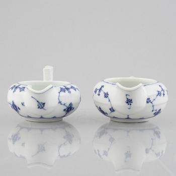 Two 'Musselmalet' porcelain creamers, Royal Copenhagen, one model 55, 19th century.