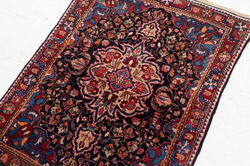 A Sarouk/Jozan rug, c. 86 x 64 cm.