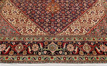 A Tabriz carpet, approximately 360 x 255 cm.