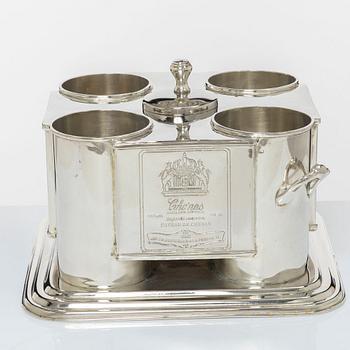 A silver plated four-bottle wine cooler.