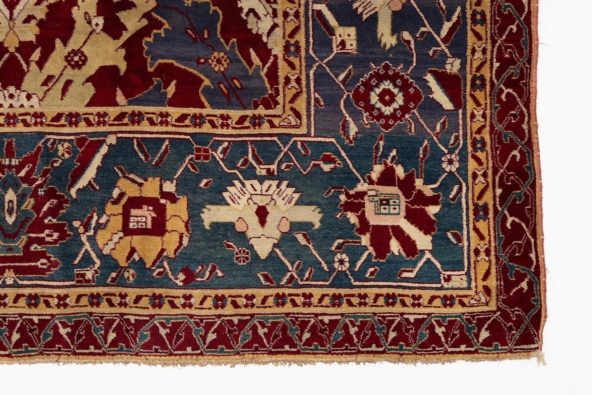 An Antique Agra carpet of 'Dragon Lattice' design, North India, 375 x 298 cm.