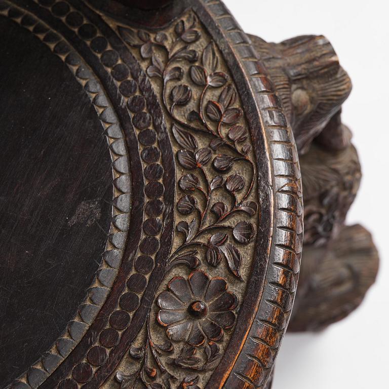 A pair of carved 'blackwood' armchairs, Bombay presidency, British Raj, circa 1880.