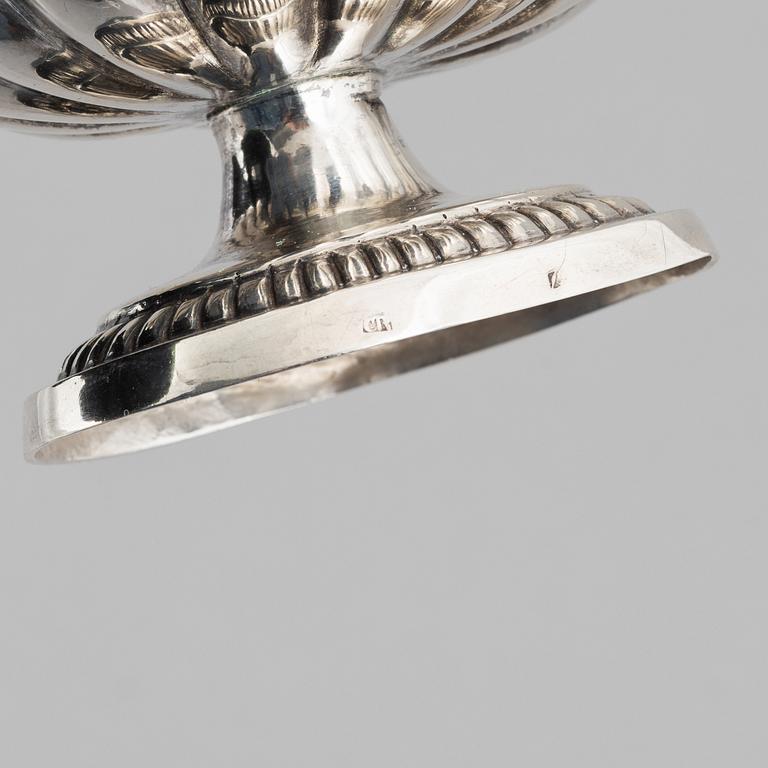 A silver sugar caster from E. S. Barnsley & Co, Birmingham,  1914, and a silver salt cellar with indistinct marks.