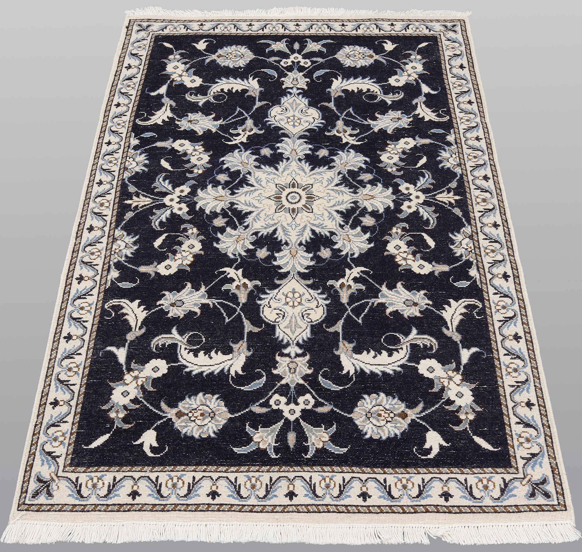 A pair of Nain rugs, ca 135 x 90 & 134 x 89 cm.