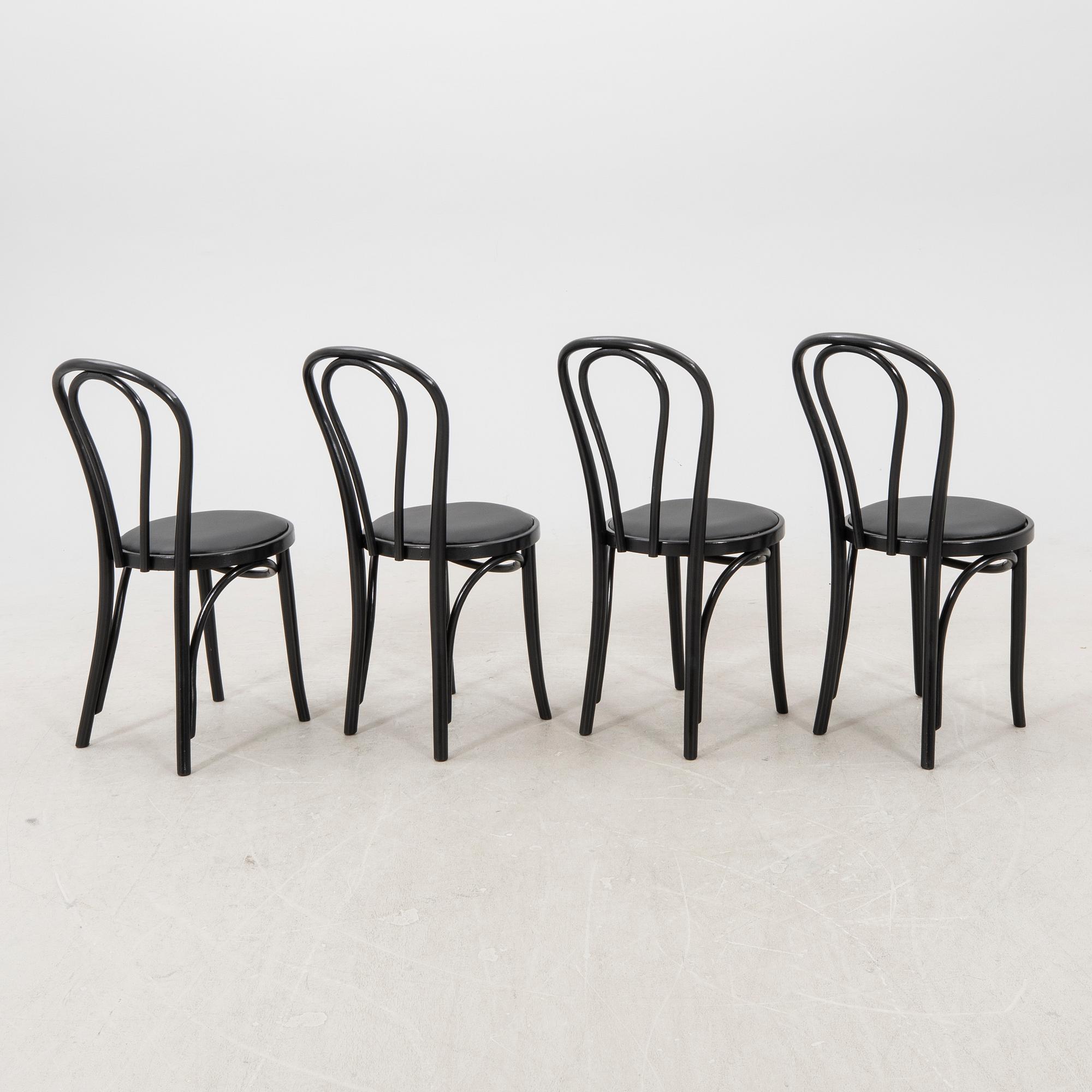 A swt of four painted chairs later part of the 20th century.