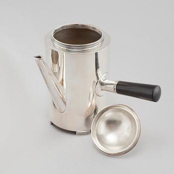 A silver coffee pot, a creamer and a sugar bowl by C F Carlman in Stockholm, 1937 and 1945.