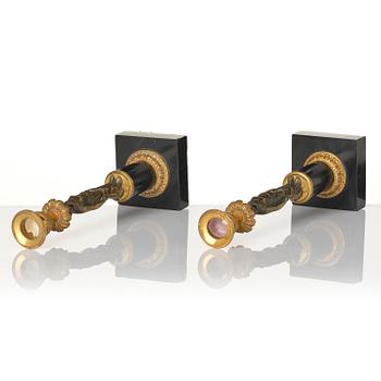 A pair of late Gustavian marble and ormolu candlesticks in the manner of F. L. Rung (1758-1837).