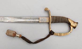 An m/1865 Russian officer's sabre with St Anna order and cyrillic engraving "For Bravery".