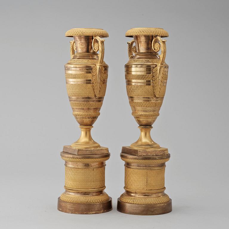 A pair of French Empire early 19th century urns.