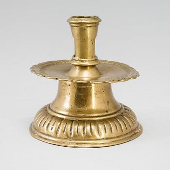A 16th century bronze candlestick.