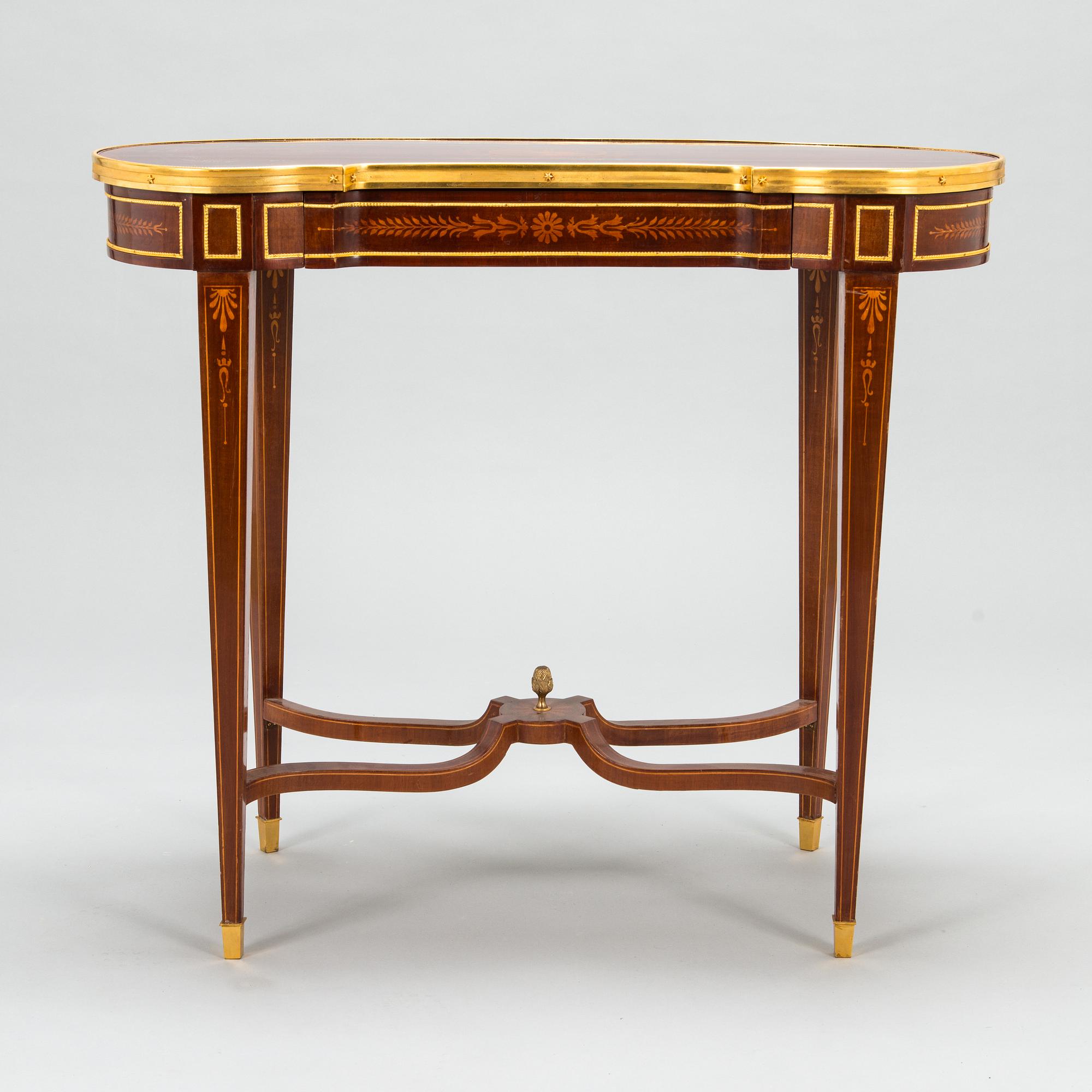 A Directoire style marquetry table from around year 1900.