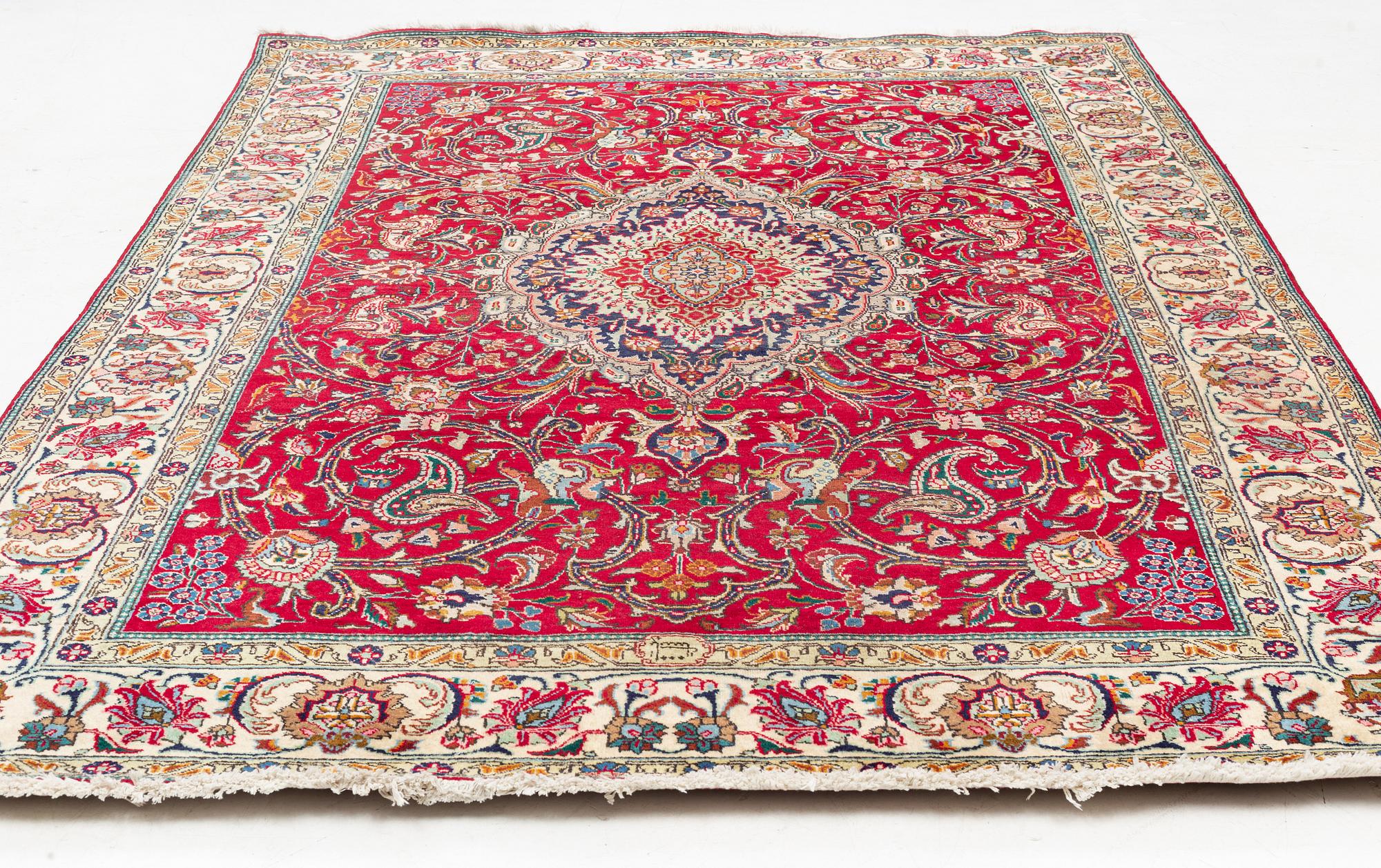 A Tabriz Carpet, circa 316 x 220 cm.