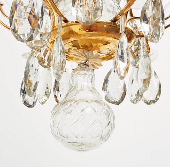 A pair of Swedish Rococo 18th century six-light chandeliers by Olof Westerberg dated 1789 and 1790.