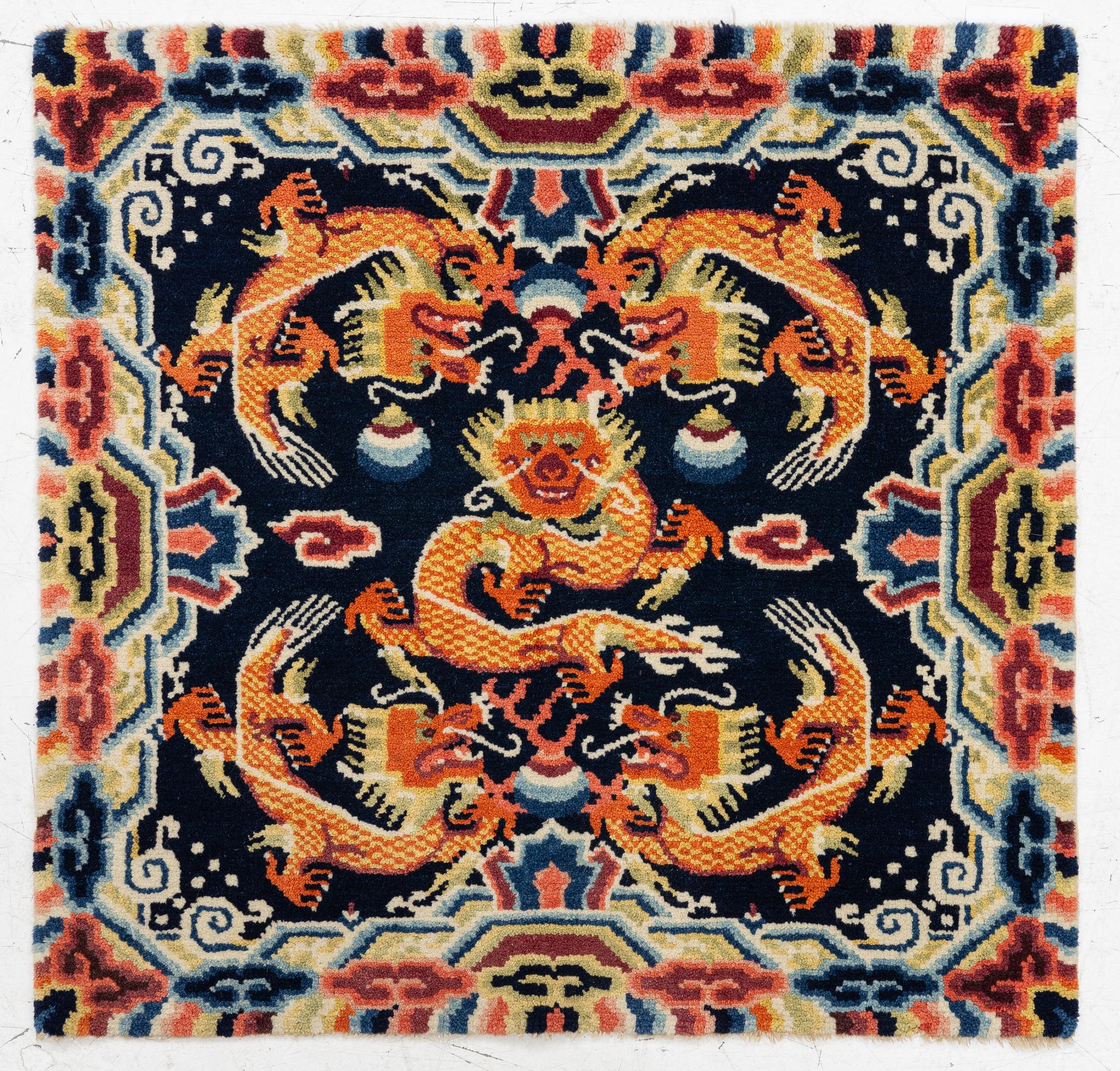 A Chinese small square rug, semi-antique, 65 x 68 cm.
