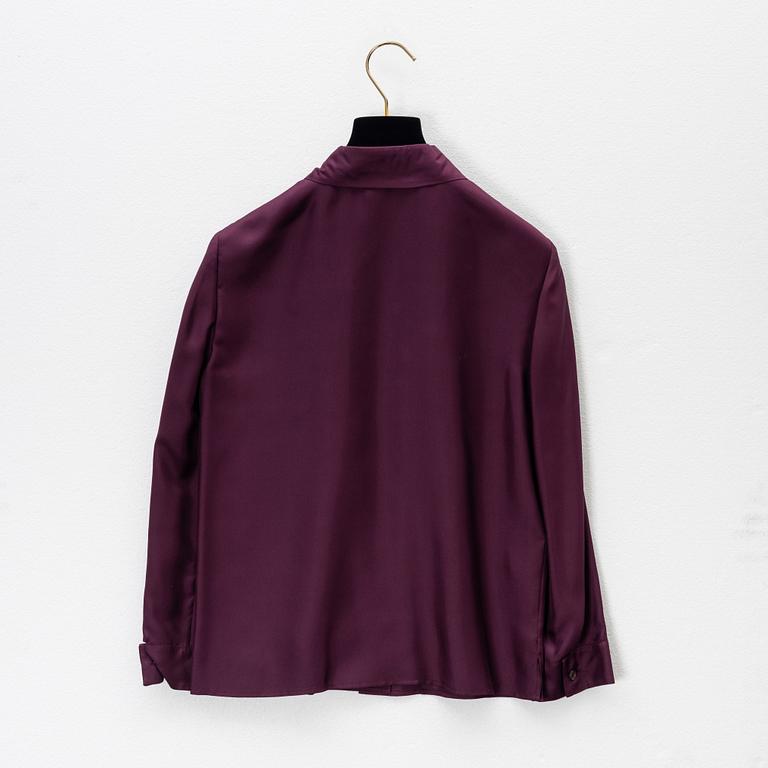 Prada, a burgundy silk blouse, size 36.