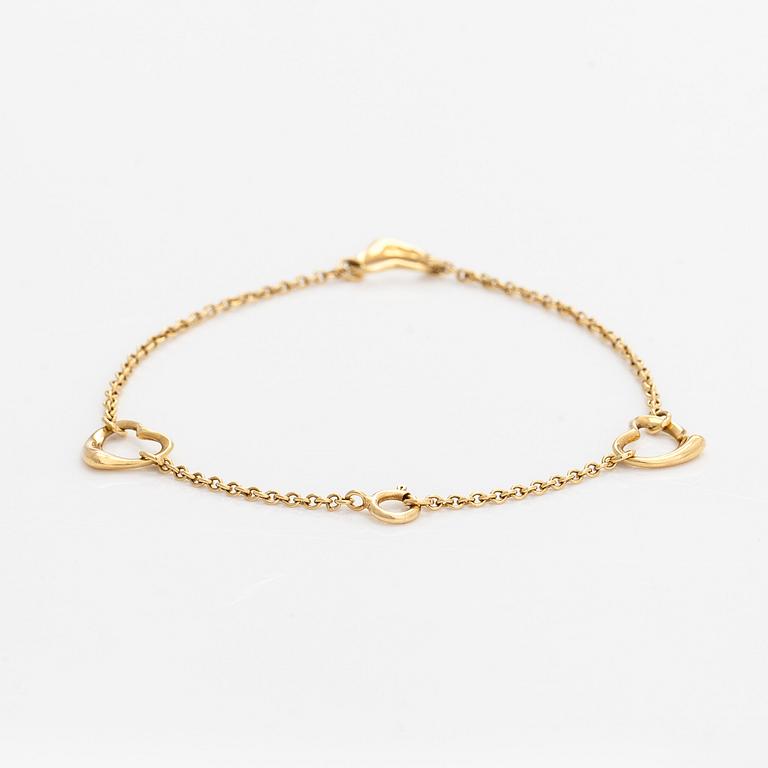 Tiffany & Co, an 18K gold 'Open Heart' bracelet.