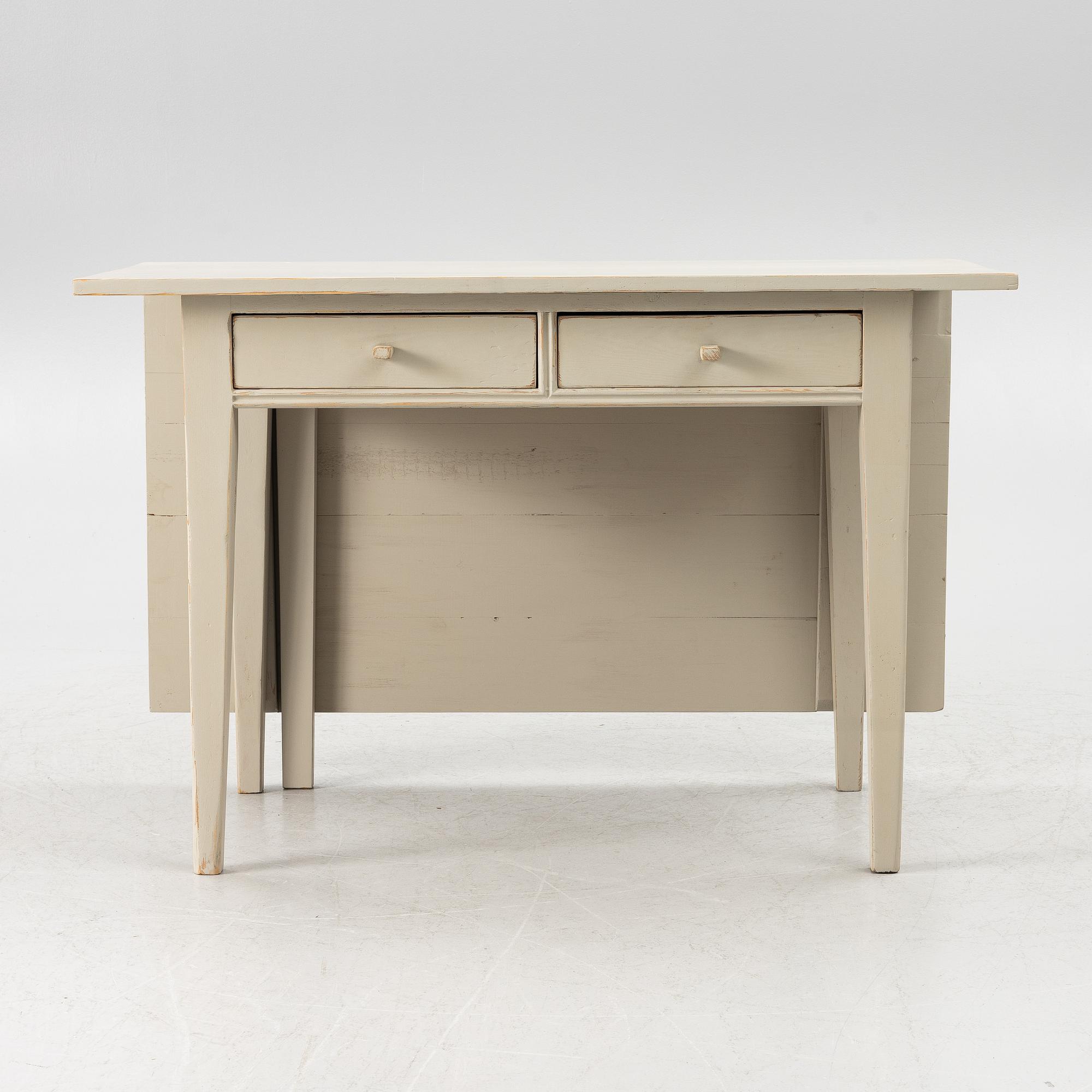 A drop-leaf table, late 19th century.