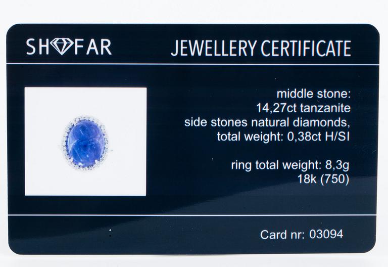 Cabochon-cut tanzanite and brilliant-cut diamond cocktail ring.