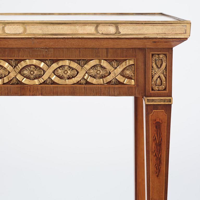 A Gustavian marquetry, ormolu-mounted, and marble table by G. Iwersson (master in Stockholm 1778-1813), signed 1781.