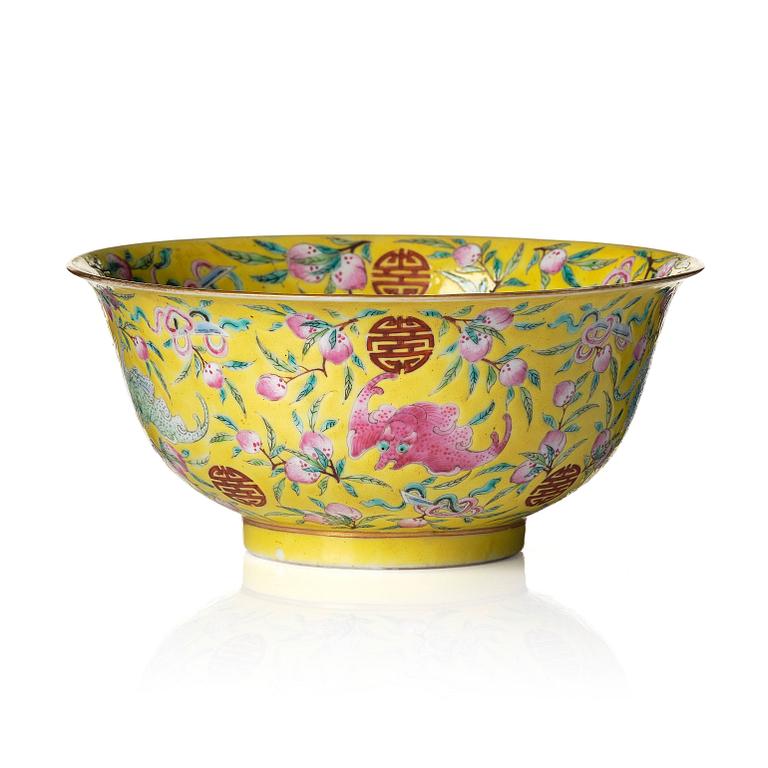 A yellow glazed 'nine bats and peaches' bowl, late Qing dynasty with Guangxu mark.