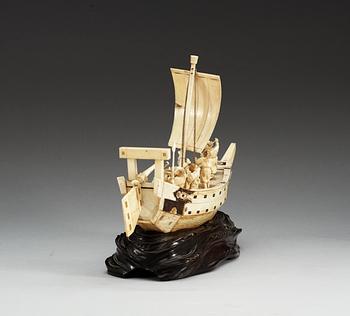 A Japanese ivory model of a ship with fishermen, Meiji period ca 1900.