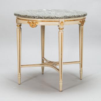 A Gustavian style sofa and table from early 20th century.