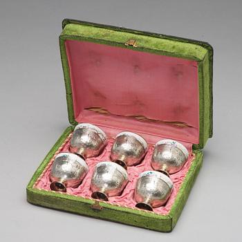 227. A set of six Ottoman parcel-gilt silver Xarfs with Russian Kuznetzov porcelain cups, c. 1910.