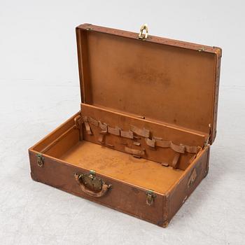 Louis Vuitton, a leather suitcase, first half of the 20th Century.