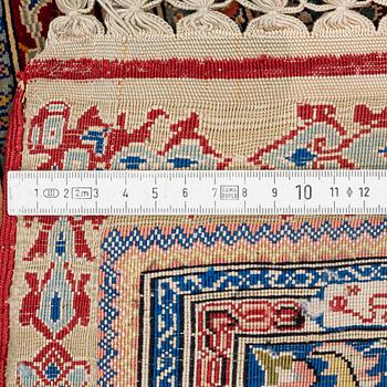 A fine silk and metal-thread Hereke, signed by Ali Oglu studio and dated 1961, c. 204 x 190 cm.