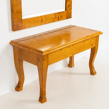 A mirror with console table, early 20th century.