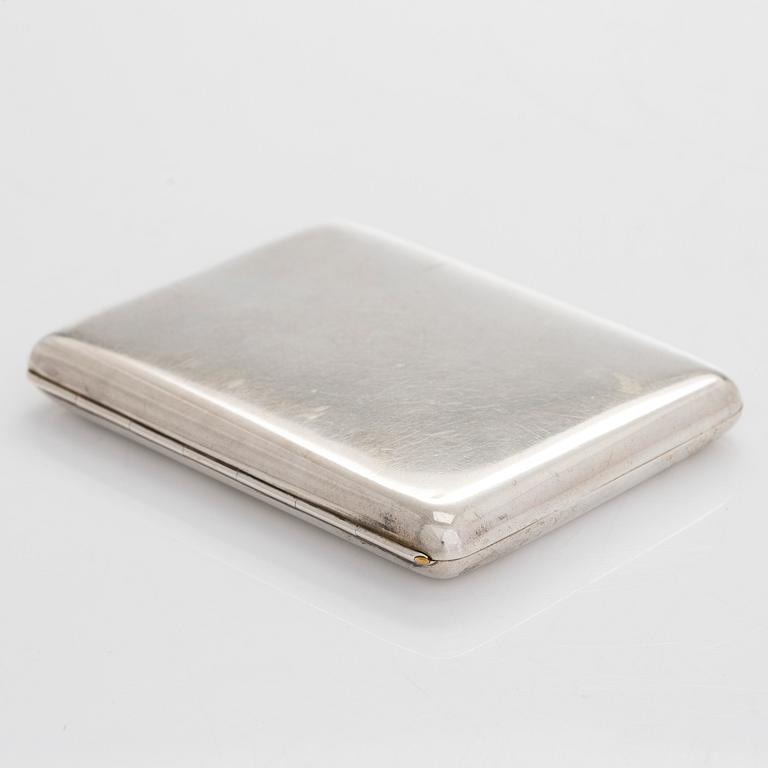 A silver cigarette case, Moscow, dated 1916.
