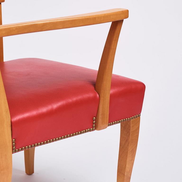 Josef Frank, a pair of walnut and red leather easy chairs, Svenskt Tenn, Sweden 1940-60s.