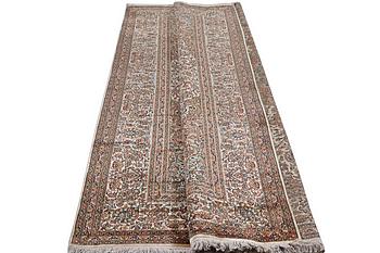 A carpet, silk Kashmir, ca 303 x 216 cm.