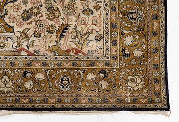 A Ghom, silk rug, c. 215 x 140 cm.