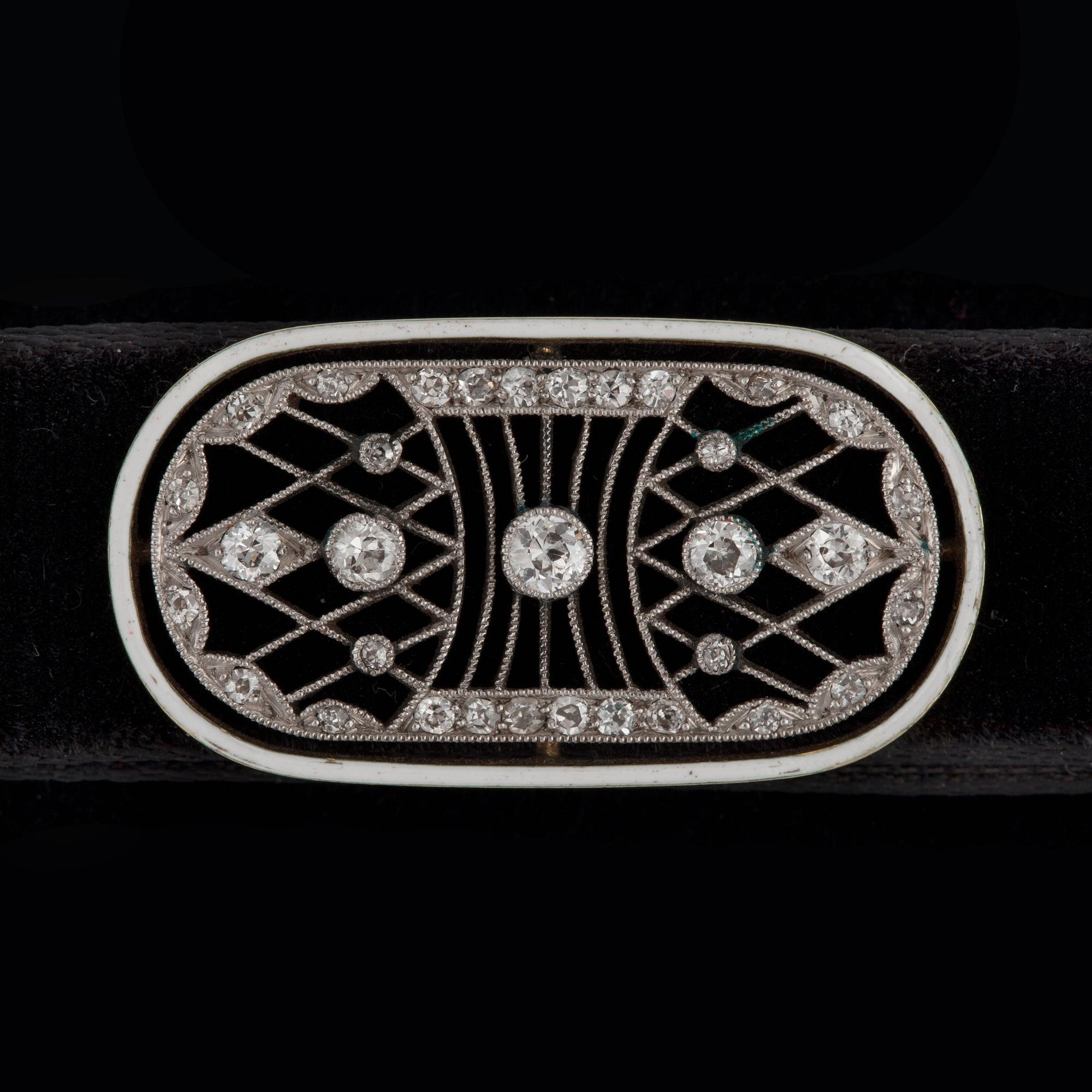 A white enamel and old-cut diamond choker. On a velvet band. Total carat weight of diamonds circa 0.50 ct.
