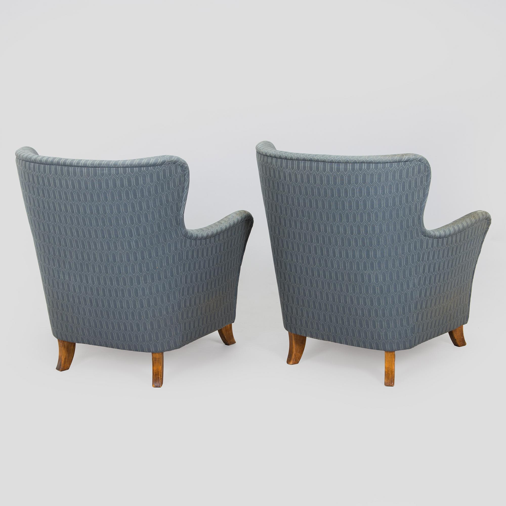 A pair of mid-20th century armchairs.
