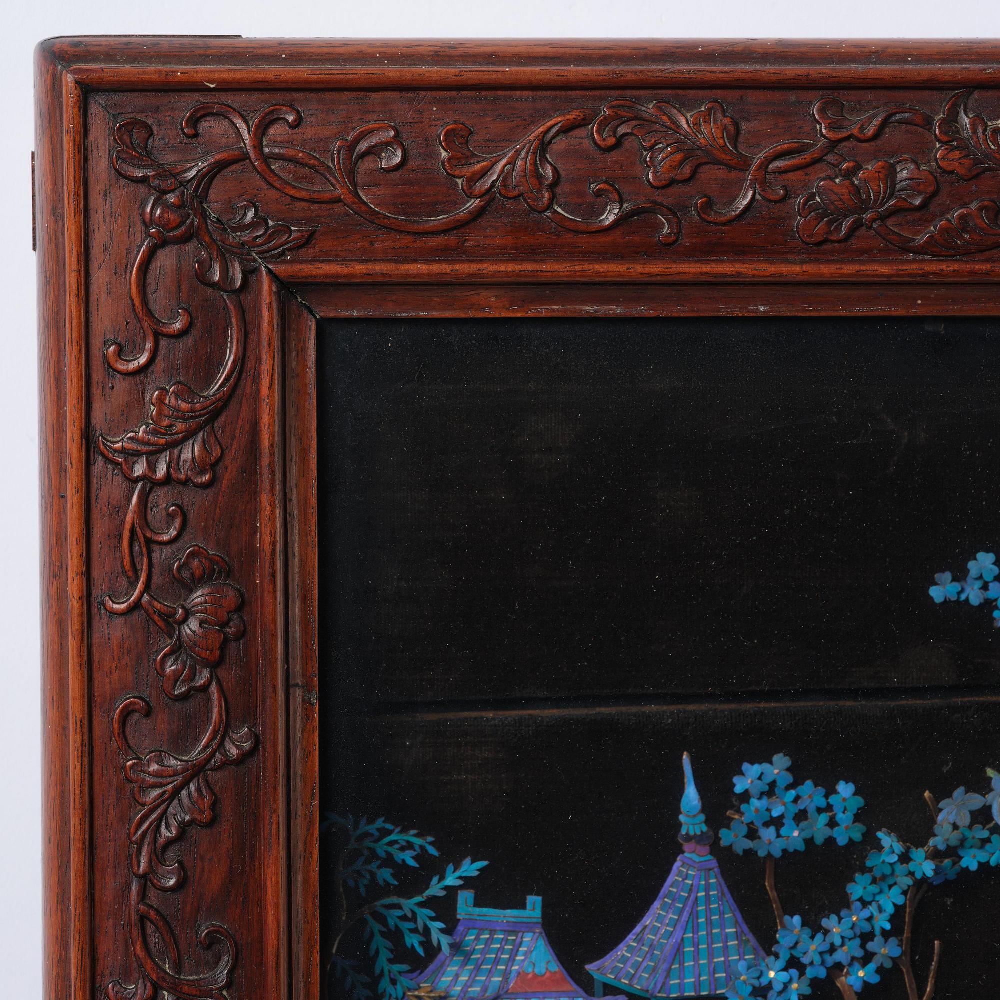 A framed ivory and kingfisher-feather-embellished wall panel, Qing dynasty, Qianlong/Jiaqing.