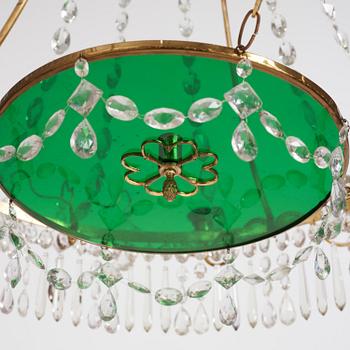 A German Louis XVI ormolu and cut-glass nine-light chandelier attributed to Johann Christoph Ermisch, late 18th century.