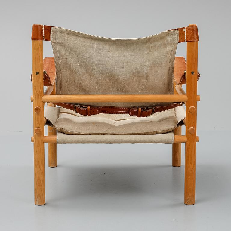 Arne Norell, a set of three "Sirocco" armchairs and two tables, Norell.