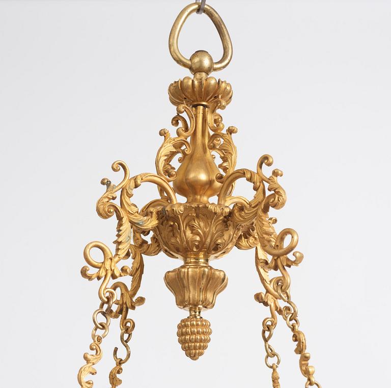 A rococo-revival gilt-brass sixteen-light chandelier, mid 19th century.