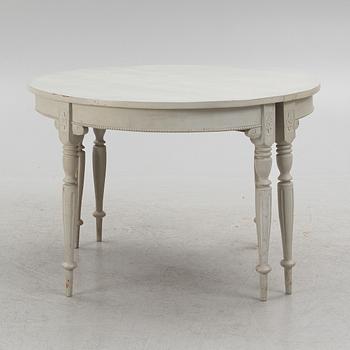 A late 19th Century painted dining table.