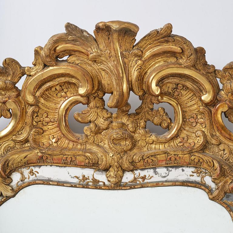 A rococo giltwood mirror attributed to N. Meunier (master in Stockholm 1754-97).