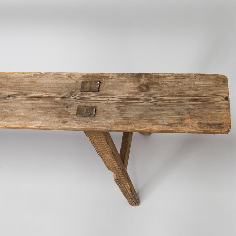 A folk art bench, circa 1900.