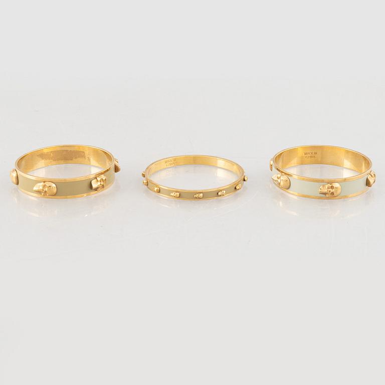 Alexander McQueen, three bracelets and a ring.